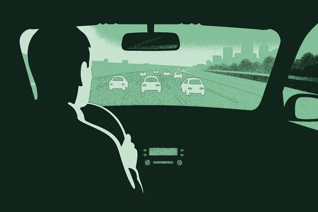 First-person view from the back seat of an Uber, looking forward over the silhouette of the driver as cars stretch out on the highway ahead and a distant cityscape rises through the windshield